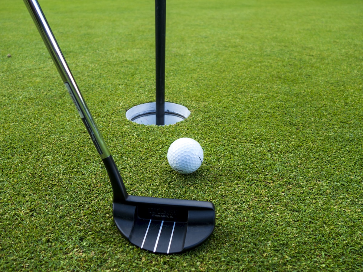 Multiple cups and break contours on a custom putting green designed for daily practice.