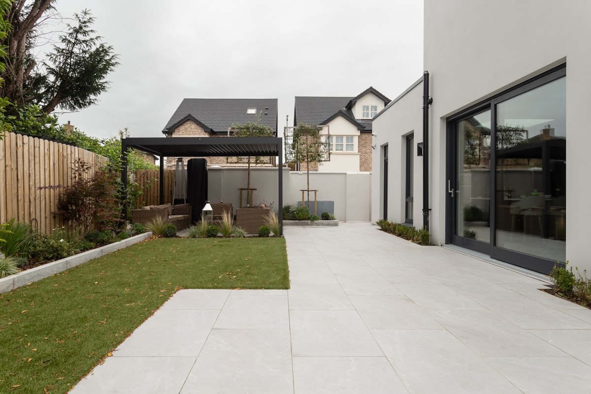 A complete front-to-back yard makeover with artificial grass and drought-resistant landscaping.