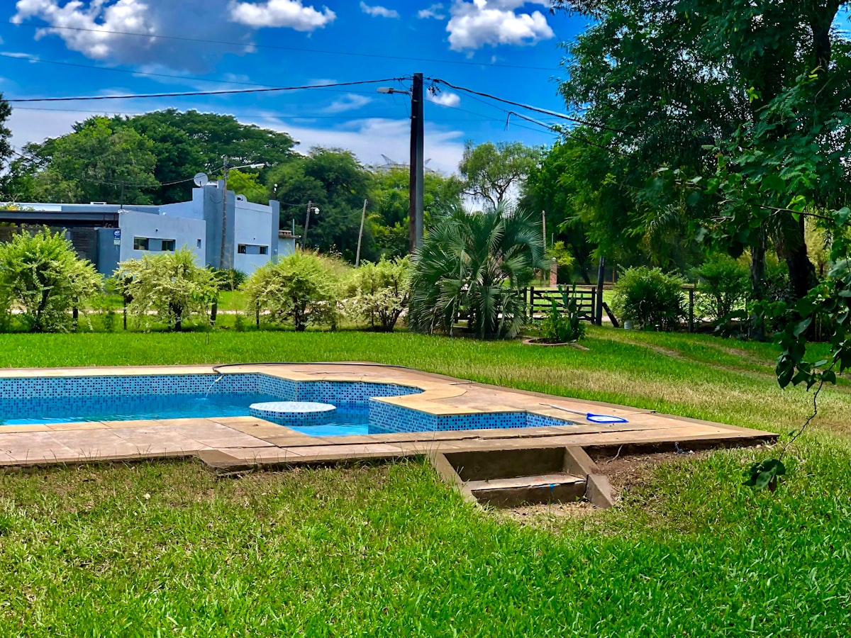 Aerial view of a pool and turf combination — slip-resistant surface that drains instantly.