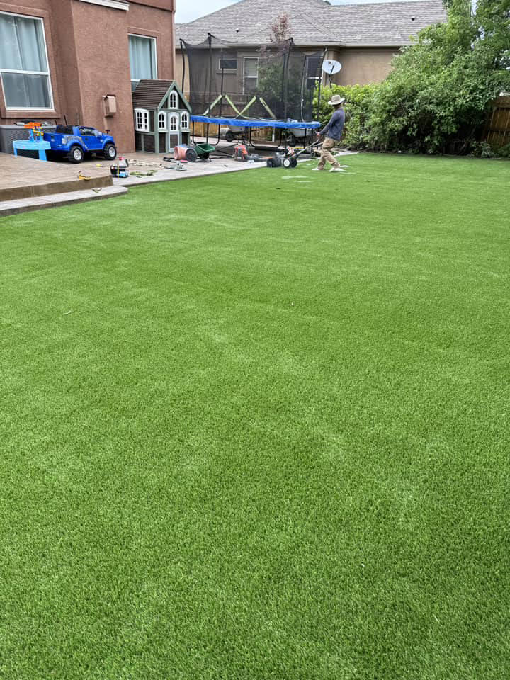 Pet- and kid-friendly artificial turf backyard with a playhouse — artificial turf in Centennial, CO